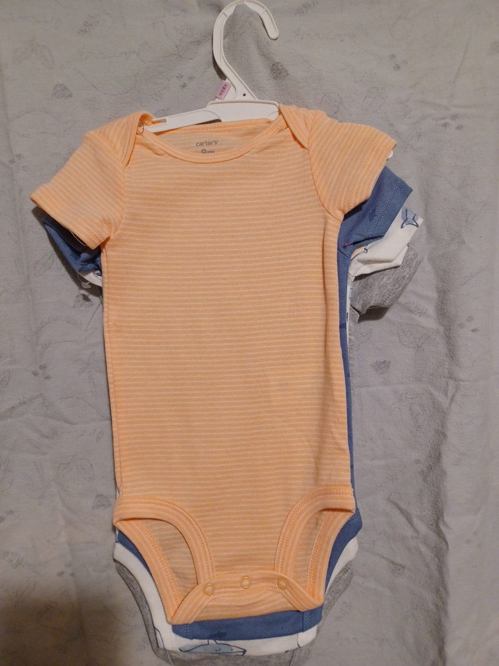 Carter's 4-piece baby bodysuit set, 9M