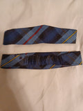 Blue plaid school uniform headband with red and yellow accent stripes